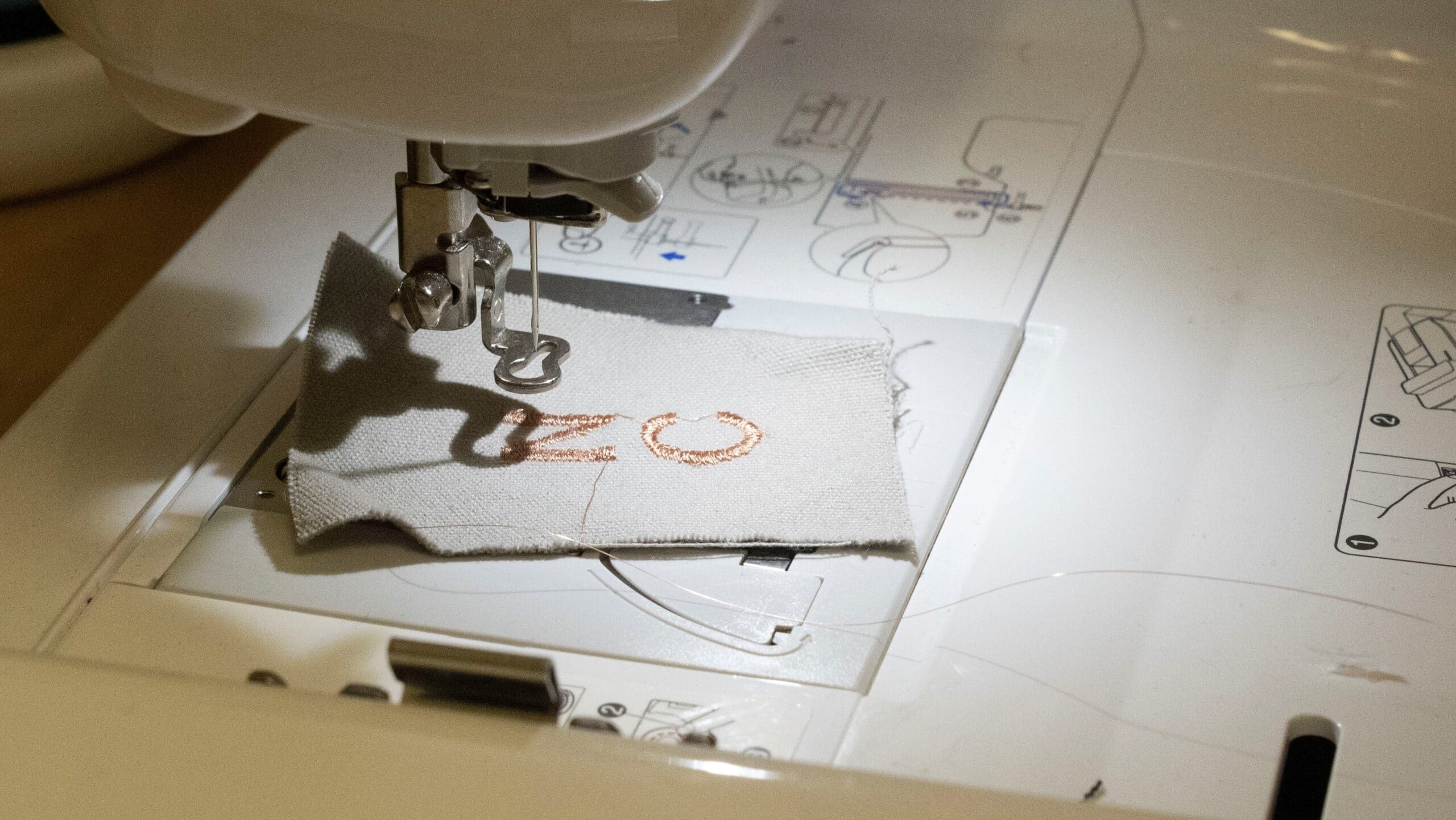 Embroidering power-generating yarns onto fabric