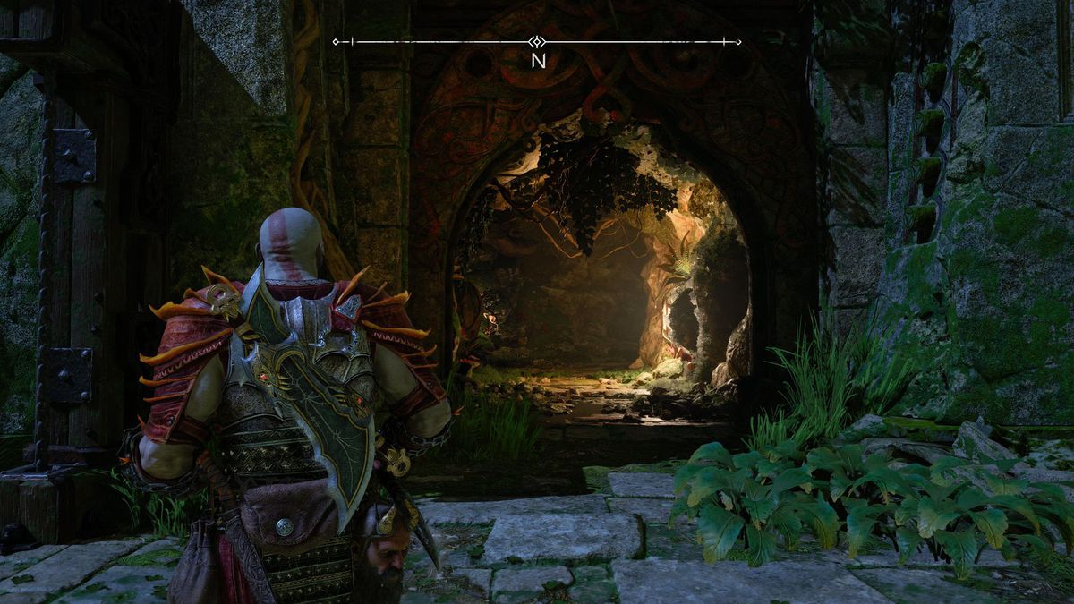 Kratos staart naar een grot in een muur in God of War Ragnarok.