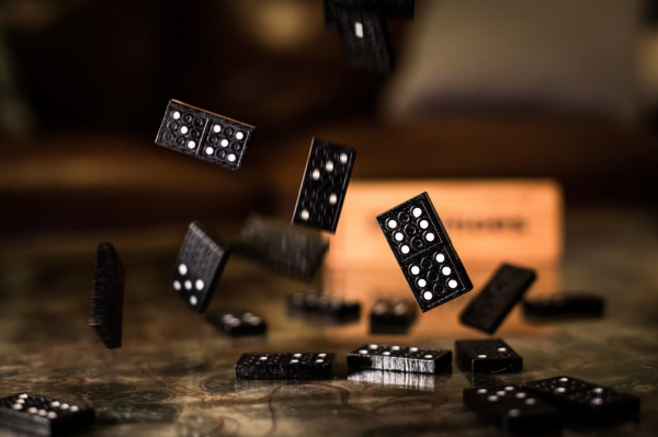 Unsplash Charl Folscher Dominoes - Which Companies Were Affected by FTX's Collapse?