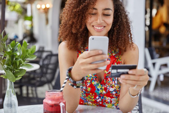 AdobeStock 199672469 women makes mobile payment - Why RPA Is Key To Fintech Growth