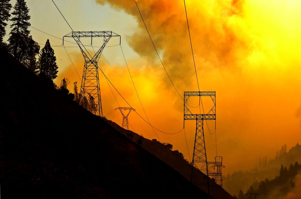The Camp Fire, which was ignited by PG&E power infrastructure, burns in 2018.
