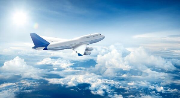 Flying Carbon Offsets as Airplane Flies Thru Skies