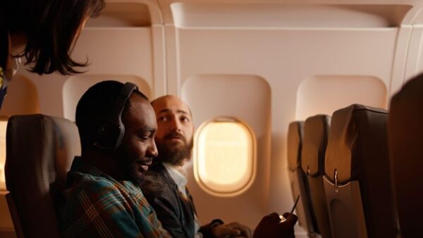 Men Checking Carbon Footprint While in Flight