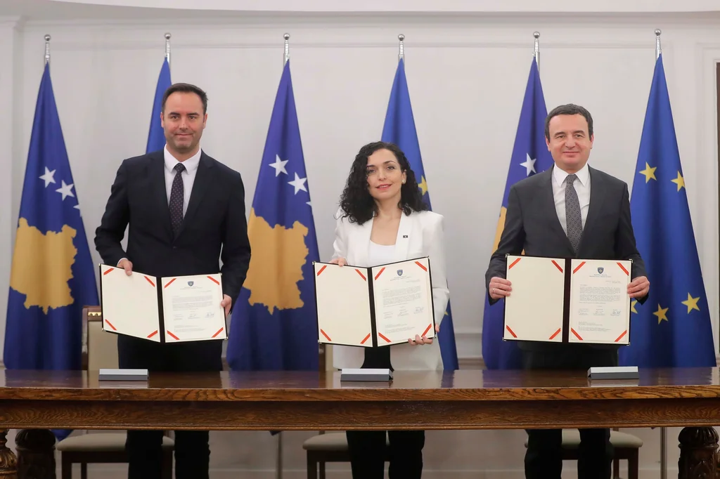 Kosovo applies to join EU. Speaker of the Parliament on the left, President in the center, and Prime Minister on the right.