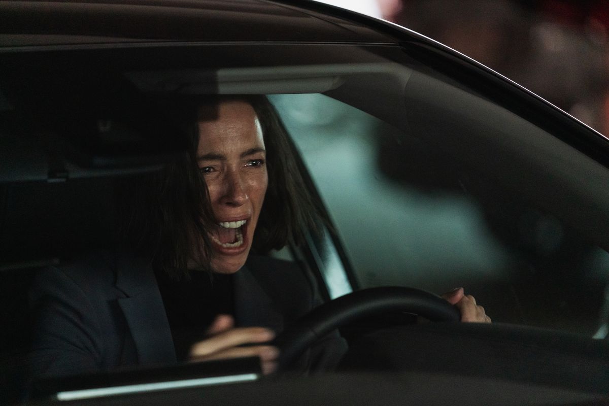 Rebecca Hall screams in her car in the Shudder movie Resurrection
