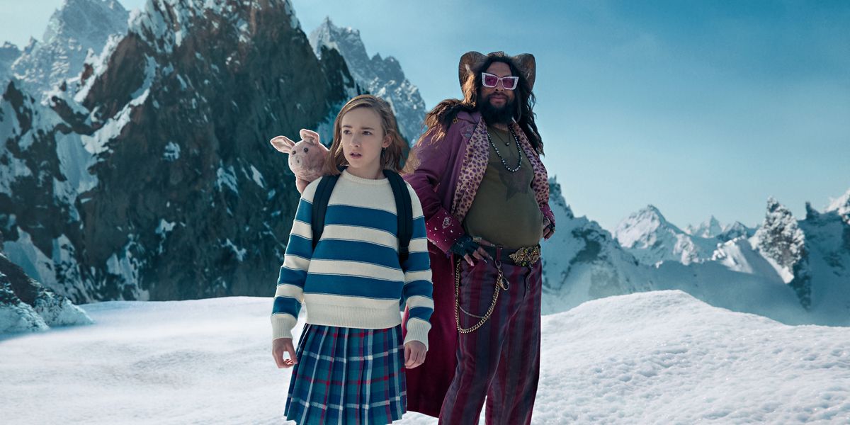 Marlow Barkley and Jason Momoa (wearing an outlandish purple outfit) stand in the snow in Slumberland.