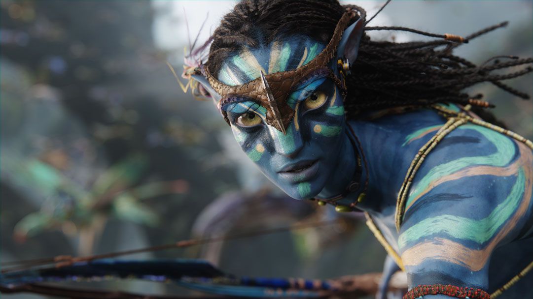 The main character in James Cameron’s Avatar, a blue-skinned alien with large eyes and hair that resembles locs. Stripes of war paint are on his face and shoulders, and he carries a bow.