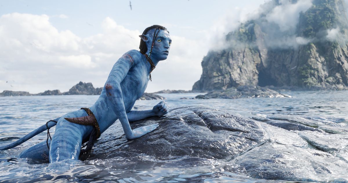 a lanky teenage blue-skinned na’vi on the back of a space whale in avatar: the way of water