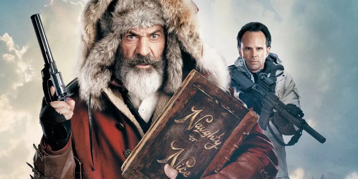 Chris Kringle (Mel Gibson), wearing a red coat and huge furry winter ushanka, holds up a large revolver and clutches a book labeled “Naughty or Nice” in formal script. Behind him, Jonathan Miller (Walton Goggins) stands scowling with an automatic rifle, in a promotional composite image for 2020’s Fatman