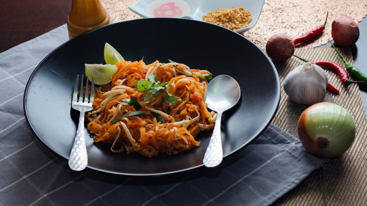 pad thai noodles on a plate at a restaurant