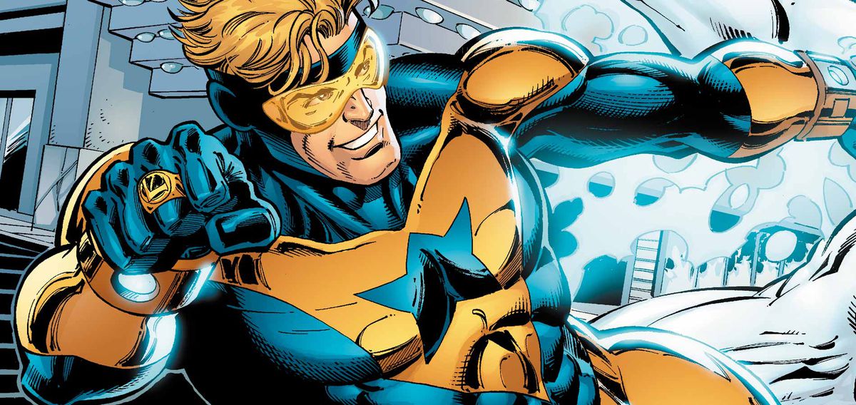 Booster Gold zips away from an energy blast