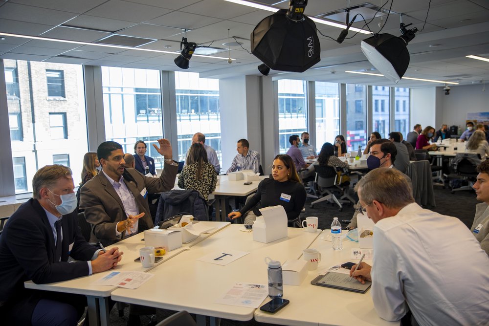 Participants confer at an AEG stakeholder challenge in New York.