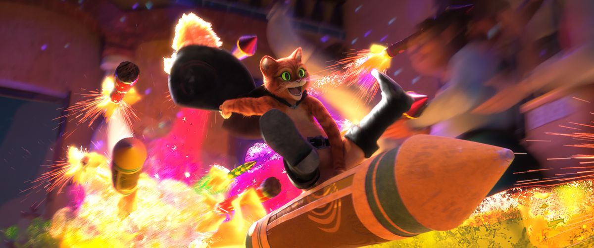 Puss rides a rocket as other rockets explode in the background in Puss in Boots: The Last Wish