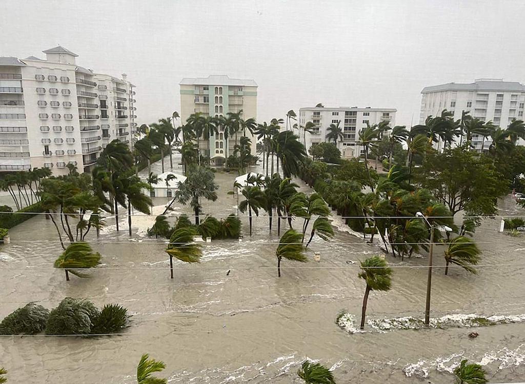 The storm surge from Hurricane Ian sends water through the streets of Naples, Florida in 2022.