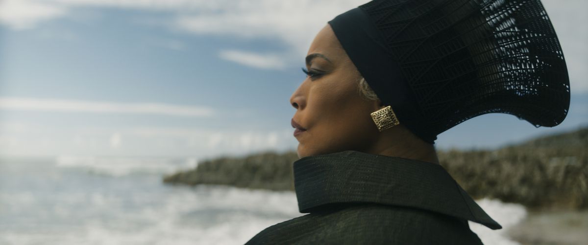 Angela Bassett gazes out at the sea as Ramonda in Black Panther: Wakanda Forever