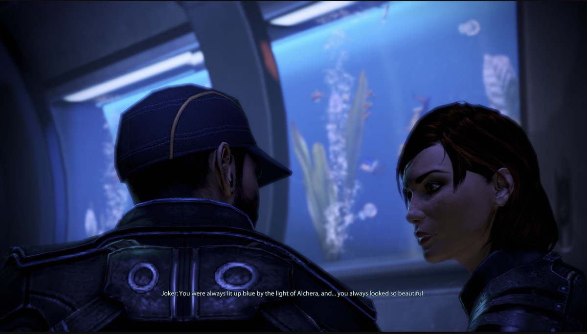 Joker, from Mass Effect: Legendary Edition, faces FemShep. He says “You were always lit up blue by the light of Alchera, and... you always looked so beautiful.”