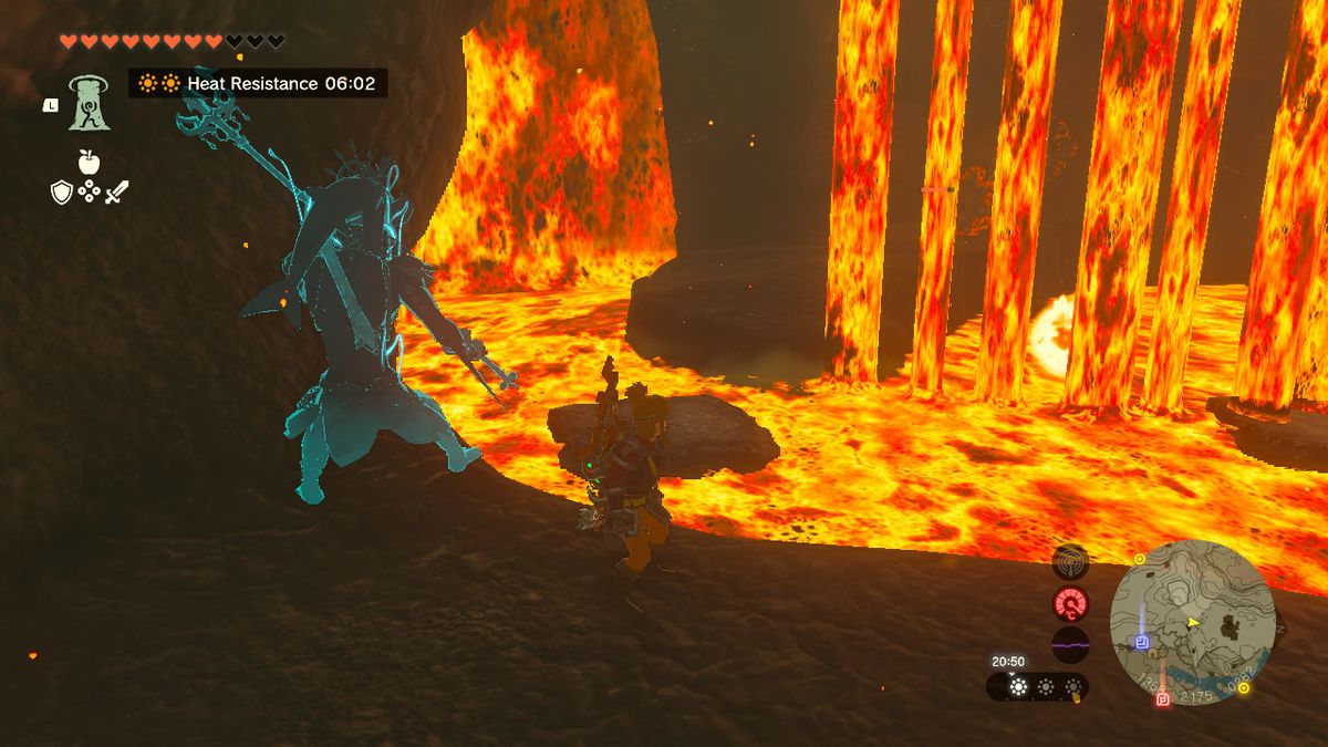 Link, Zelda Tears of the Kingdom'daki Goronbi Nehri Mağarası'ndaki bir lav şelalesinin (lav şelalesi?) yanında duruyor.