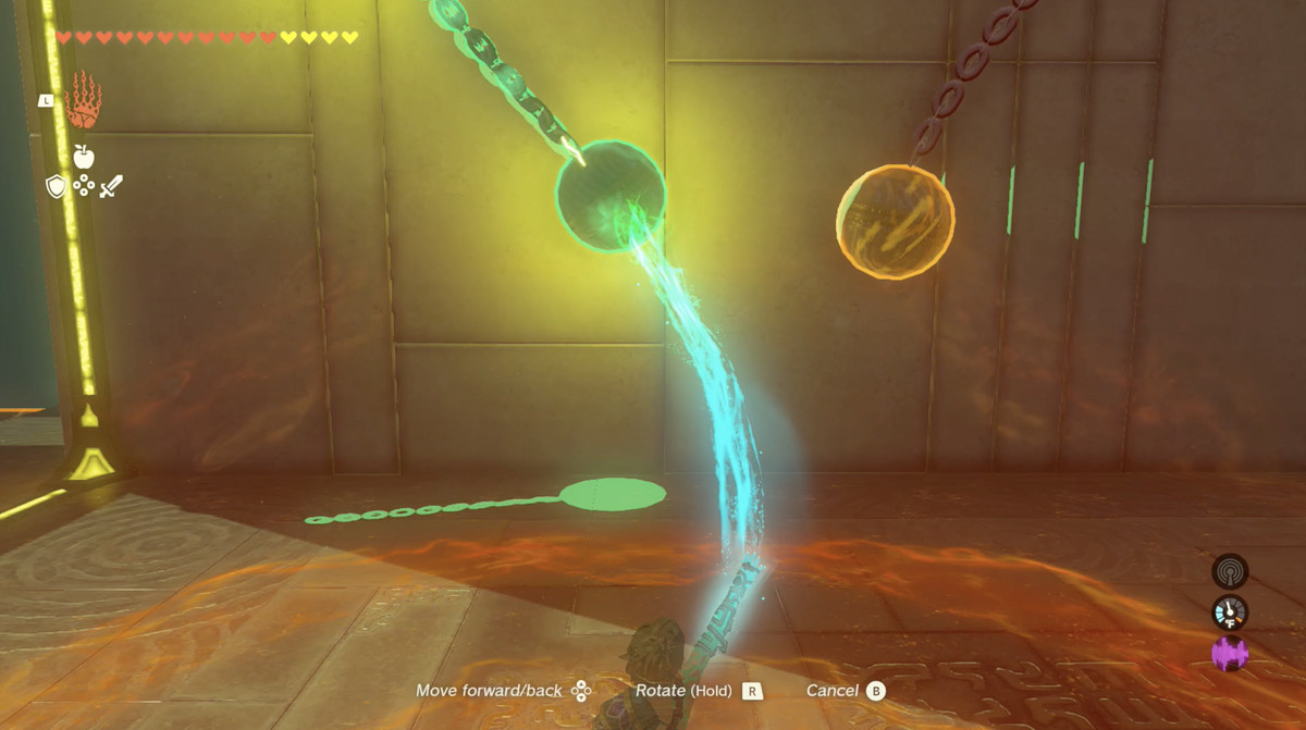 An image of a puzzle in The Legend of Zelda: Tears of the Kingdom. Link is using Ultrahand to glue an electrified hanging ball to another ball. The one on the left is swinging back and forth. 