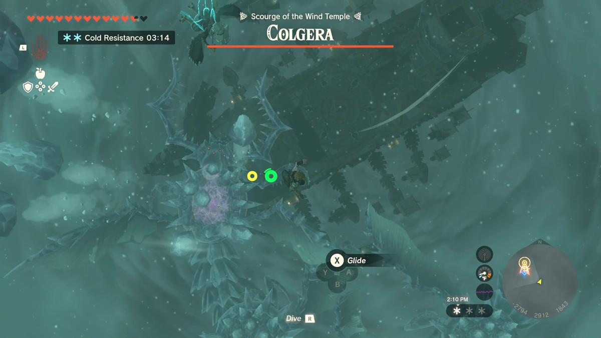 Link zweeft boven het gigantische monster Colgera op zijn zweefvliegtuig in Zelda: Tears of the Kingdom. Zijn rug is bedekt met richels van spikes gemaakt van ijs. De naam staat boven een volledig gevulde gezondheidsbalk bovenaan het scherm.