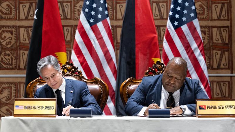 U.S. Secretary of State Antony Blinken signs the Defense Cooperation Agreement with Papua New Guinea Defense Minister Win Daki at the APEC House in Papua New Guinea, May 22, 2023, photo by Chuck Kennedy/U.S. State Department