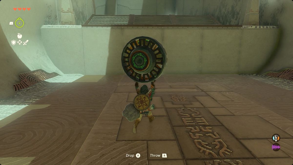 The Legend of Zelda: Tears of the Kingdom - Link carrying a fan Zonai device in Ishodag Shrine