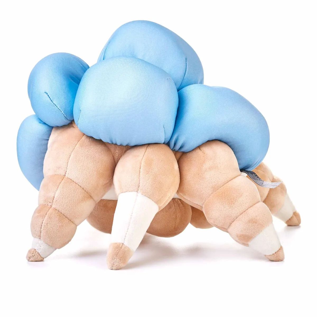 A Screeb plush from Destiny 2 standing to the side. It’s tan, stands on 6 legs, and is covered in blue pustules
