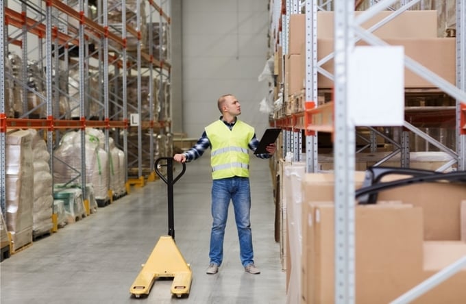 Person picking cargo and being measured by warehouse metrics
