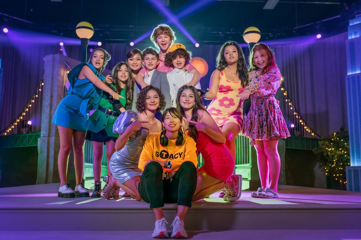 (L to R) Ivory Baker as Megan Levy, Kasey Bella Suarez as Anya, Miya Cech as Kym Chang Cohen, Judd Goodstein as Aaron, Dylan Hoffman as Andy Goldfarb, Dean Scott Vazquez as Mateo, Samantha Lorraine as Lydia Rodriguez Katz, Director Sammi Cohen, Sunny Sandler as Stacy Friedman, Dylan Chloe Dash as Tara and Millie Thorpe as Nikki in You Are So Not Invited to My Bat Mitzvah.