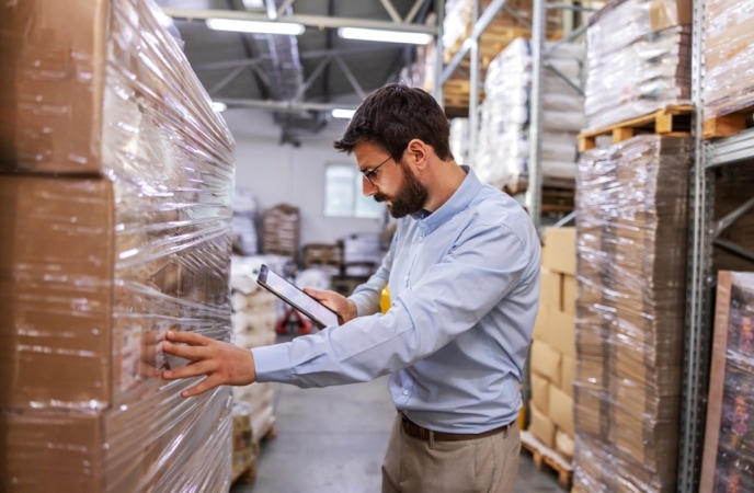 Warehouse manager dealing with overstocking