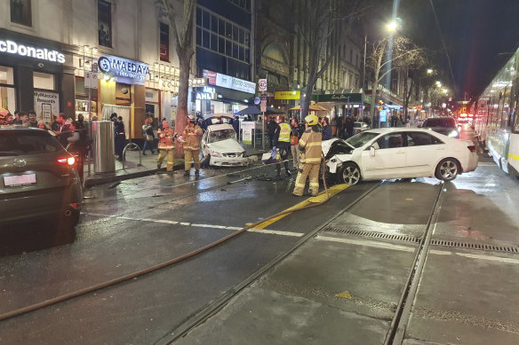 Scene of the crash near the corner Bourke and Russell streets on Friday night. 