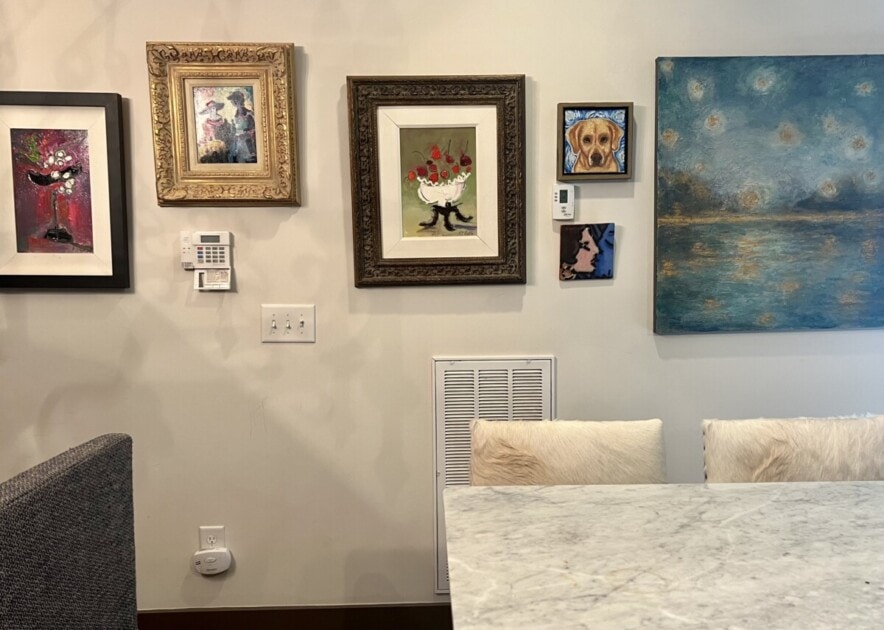 A wall with paintings