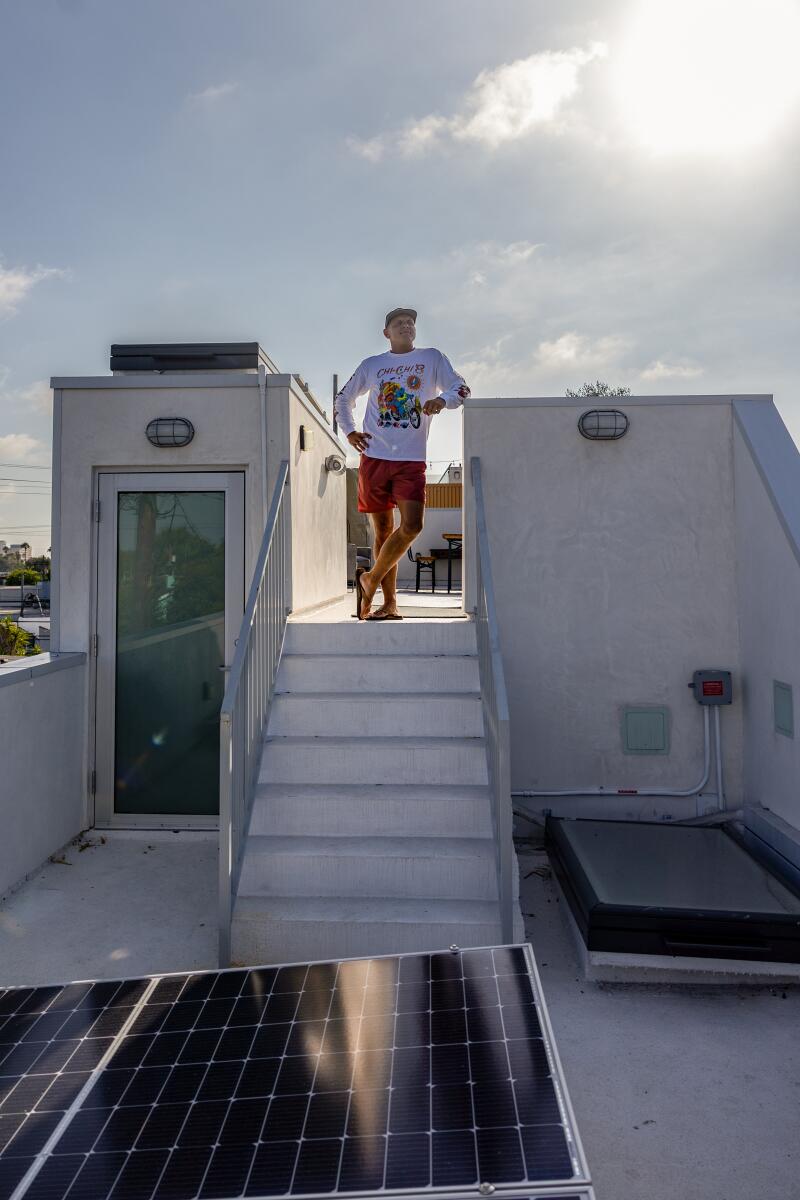 Attorney Henry Schober III stands on the rooftop deck of his two-bedroom ADU.