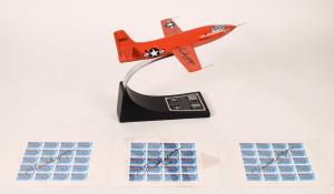 A group of three sheets of First Supersonic Flight U.S. stamps, plus a Glamorous Glennis X-1 model plane, 10 inches tall, signed on the wing by legendary pilot Chuck Yeager, rose to $938.