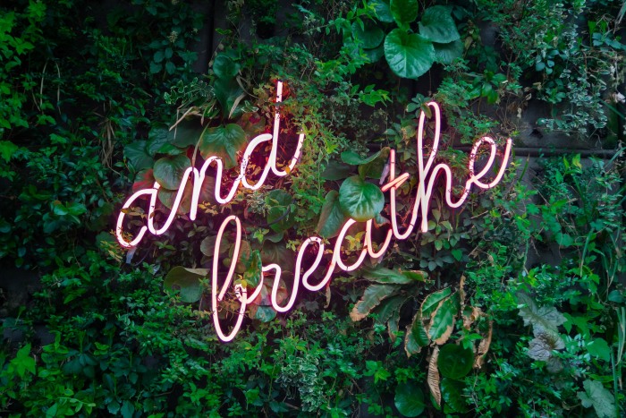 Unsplash Max van den Oetelaar And Breath Neon sign - Freelancing Finances 101: Budgeting and Tax Tips for Student Gig Workers
