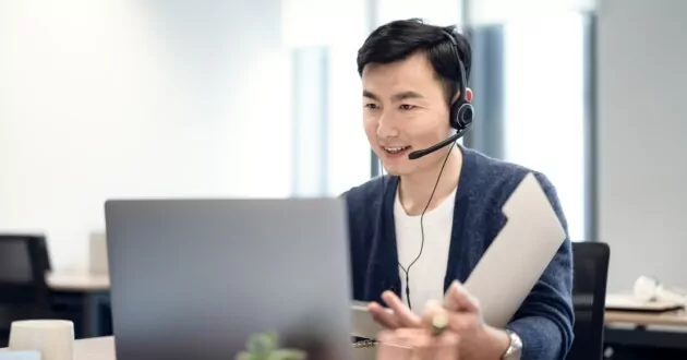 generative AI and the future of customer service - a rep on the phone while using AI to support solving customer questions