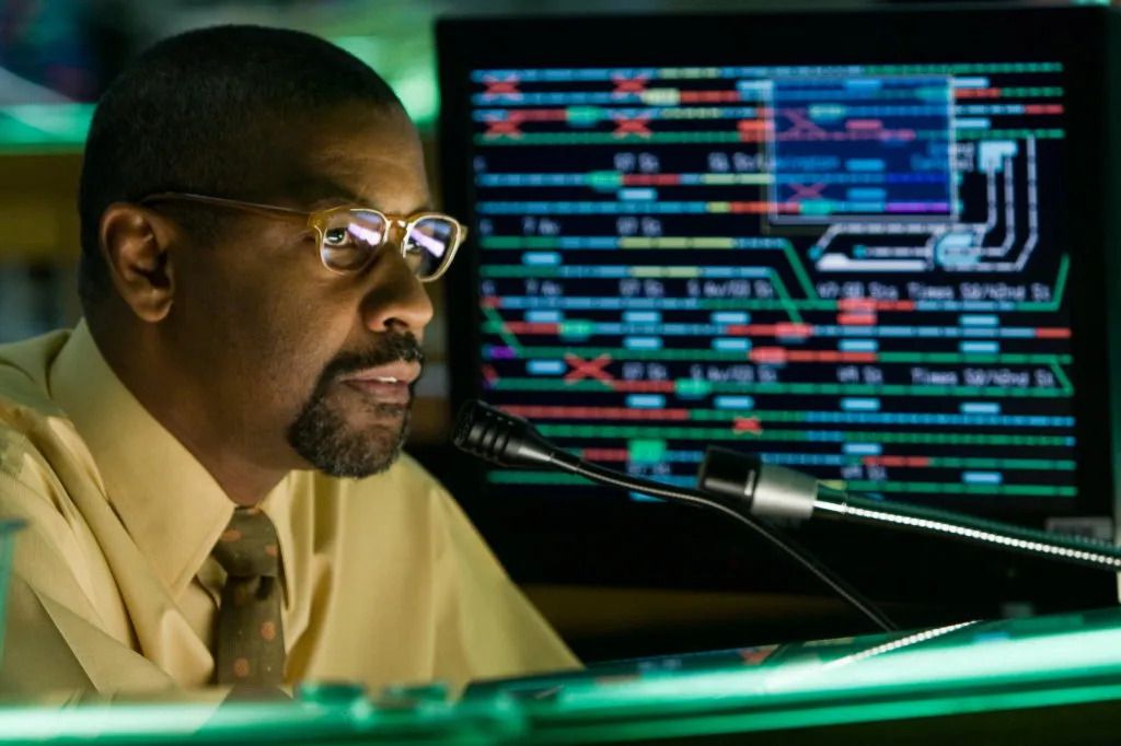 Denzel Washington in a yellow shirt wearing glasses in The Taking of Pelham 123 (2009)
