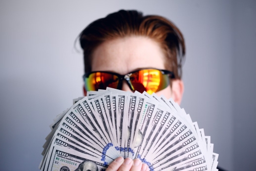 Unsplash Shane 100 bill fan of money - Katipult's Growth Surges in 2023 Raising $647M