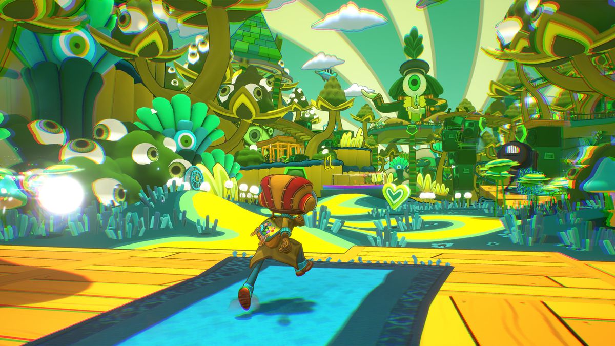 Raz runs toward a lush, psychedelic level covered in eyeballs in a screenshot from Psychonauts 2
