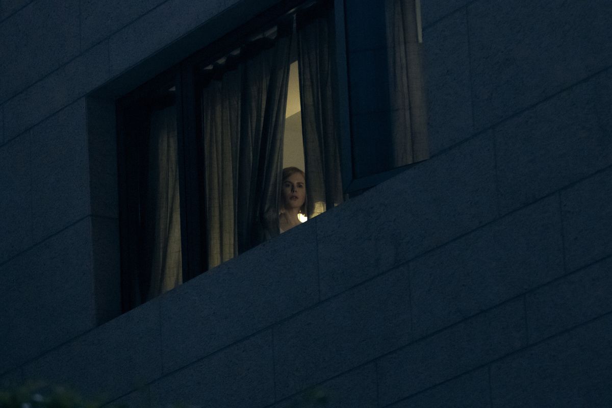 Margaret (Nicole Kidman) peers down out a window 