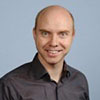 Portretna podoba Alexa Bulatkina, arhitekta rešitev pri AWS