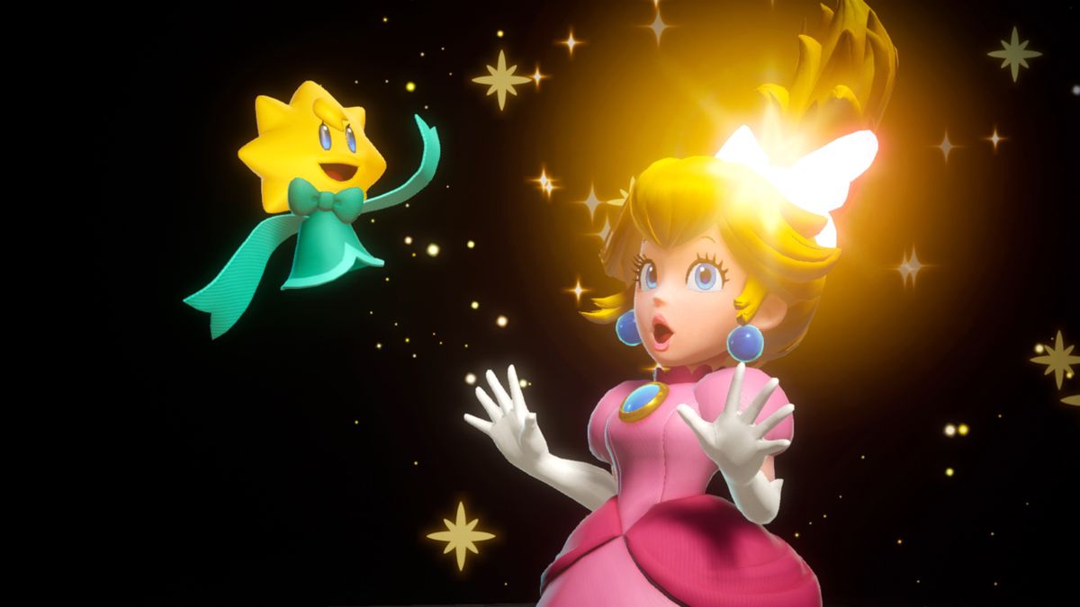Stella sử dụng phép thuật để truyền sức mạnh vào dải băng của Peach trong ảnh chụp màn hình từ Princess Peach: Showtime!