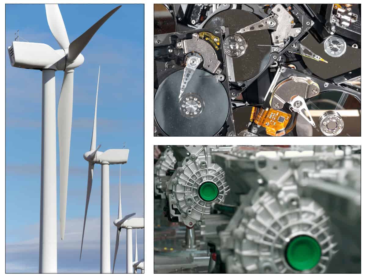 Alcune turbine eoliche, una pila di dischi rigidi riciclati e motori di auto elettriche