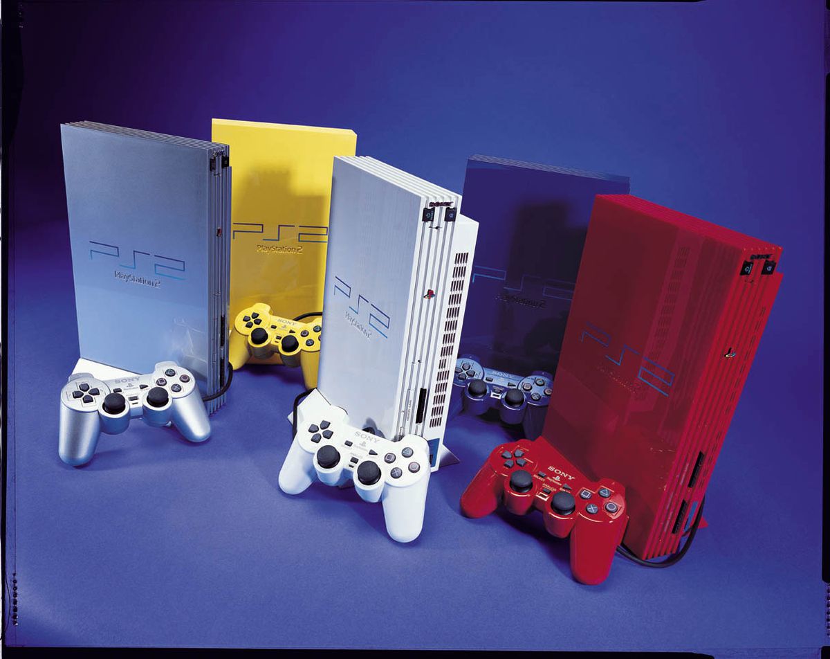 Five classic Sony PS2 consoles in silver, yellow, white, blue, and red