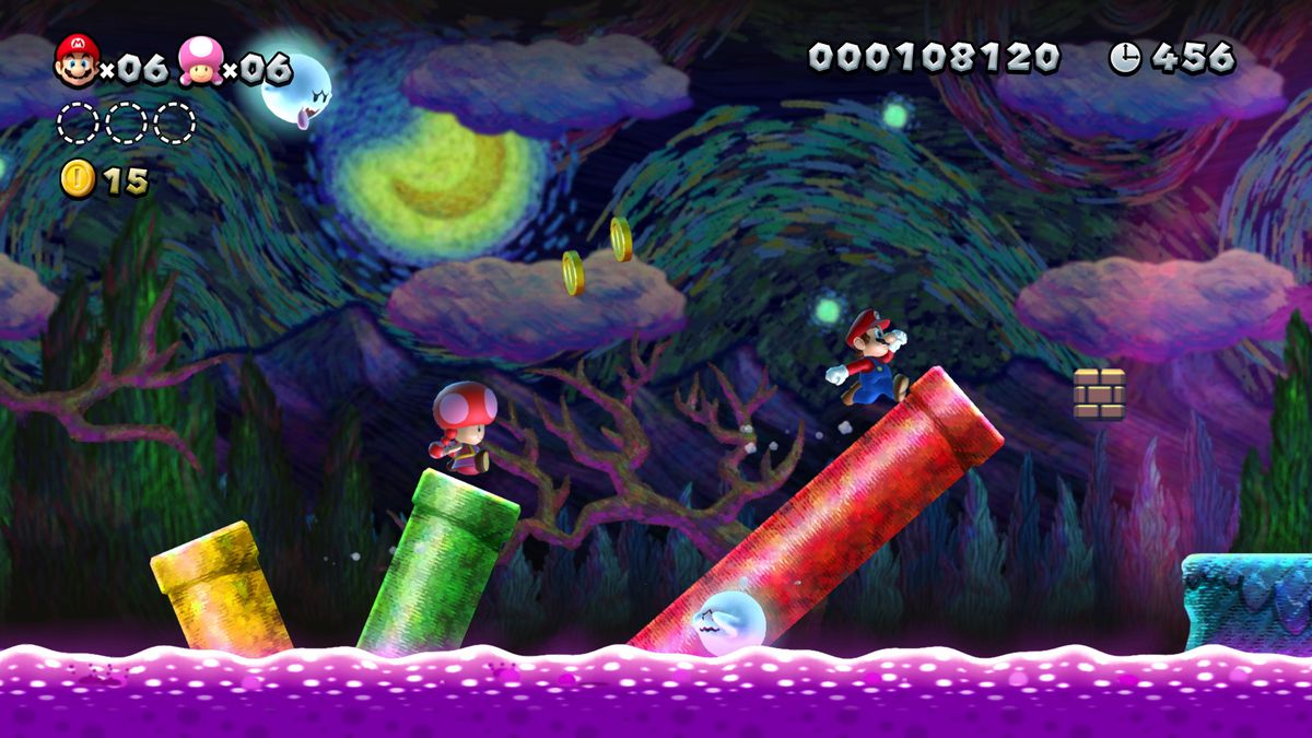 Mario and Toadette run through a spooky level in New Super Mario Bros. U Deluxe for Nintendo Switch