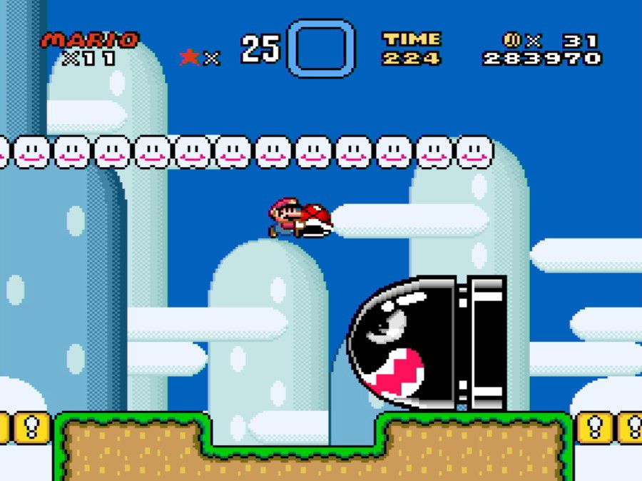 Mario jumps over a giant Bullet Bill in Super Mario World