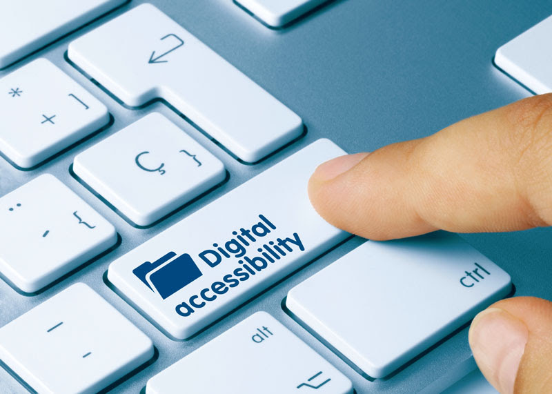 A finger pushes a keyboard key that reads "Digital accessibility"