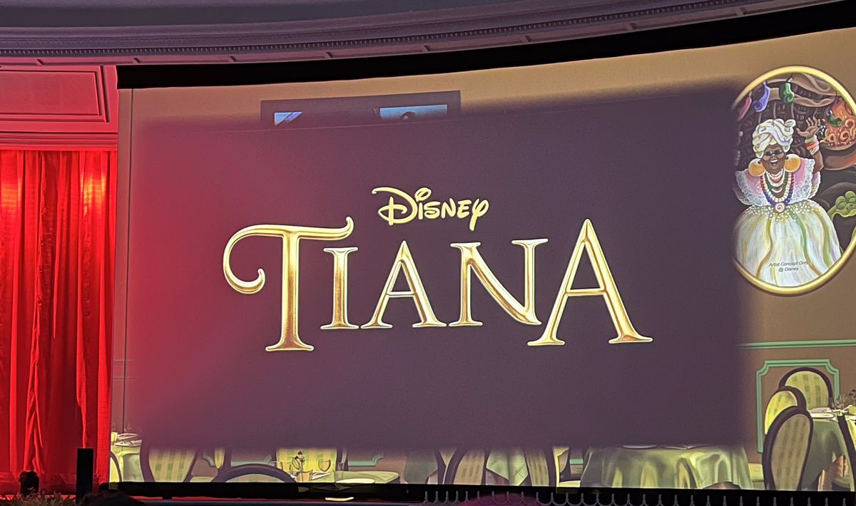 A photograph of the title for the Tiana show, which is the word “Tiana” in swirling gold writing