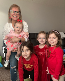 Home-based child care provider Gretchen Dunn with children in her program
