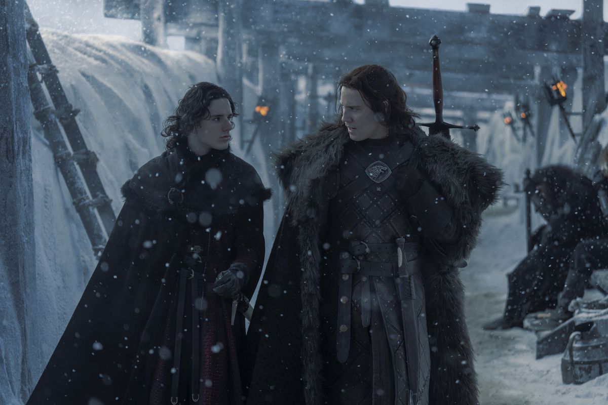 Cregan and Jace walk through the snowy trench atop The Wall in the House of the Dragon season 2 premiere