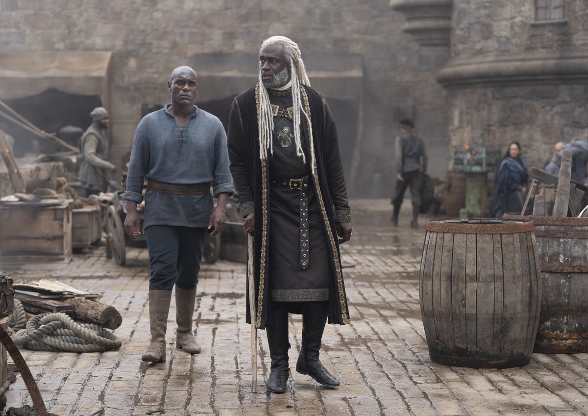Steve Toussaint as Corlys Velaryon and Adubakar Salim as Addam of Hull walking together on a dock in House of the Dragon season 2 